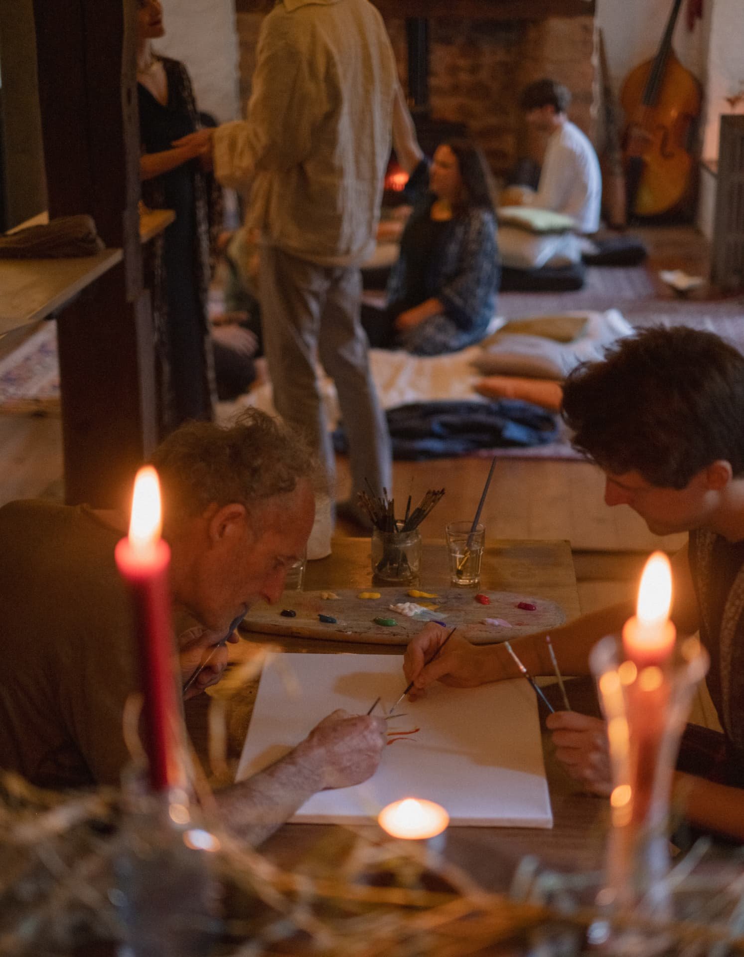 Candlelit intuitive painting during an evening session